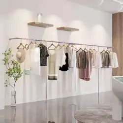 婦人服店の棚の陳列棚床から天井までの壁に取り付けられたステンレス鋼のハンガーの衣料品店の特別な陳列棚