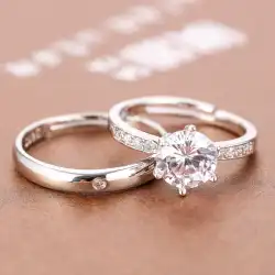 夫婦は小道具プロポーズシミュレーションダイヤモンドリングで口輪結婚式を生きる男性と女性のペアは偽のリングを開きます