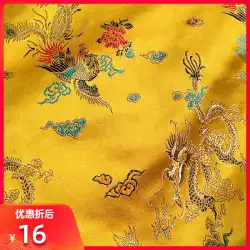 明るい黄色の中国風の王室の貴族のレトロな龍と鳳凰の縁起の良い質感のサテン生地 DIY 生地